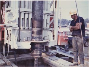 Prairie State Water technician observing well drilling equipment