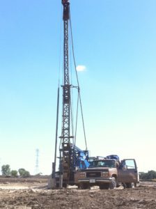 Local water well driller setting up his truck outside of a job site