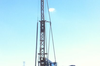 Local water well driller setting up his truck outside of a job site